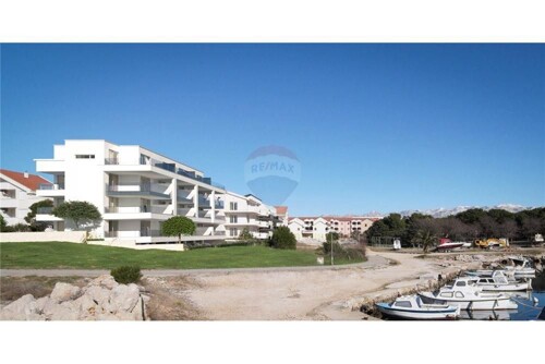 OTOK PAG, POVLJANA - 2-SOBNI APARTMAN U PRIZEMLJU, 1.RED OD